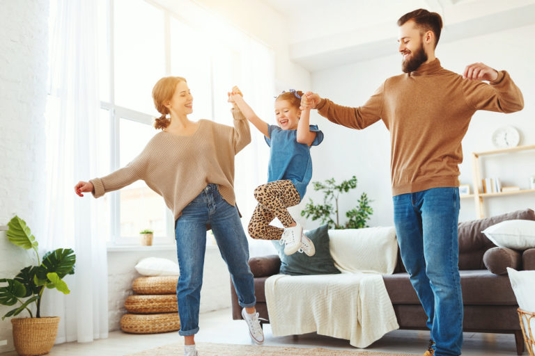 family playing with daughter